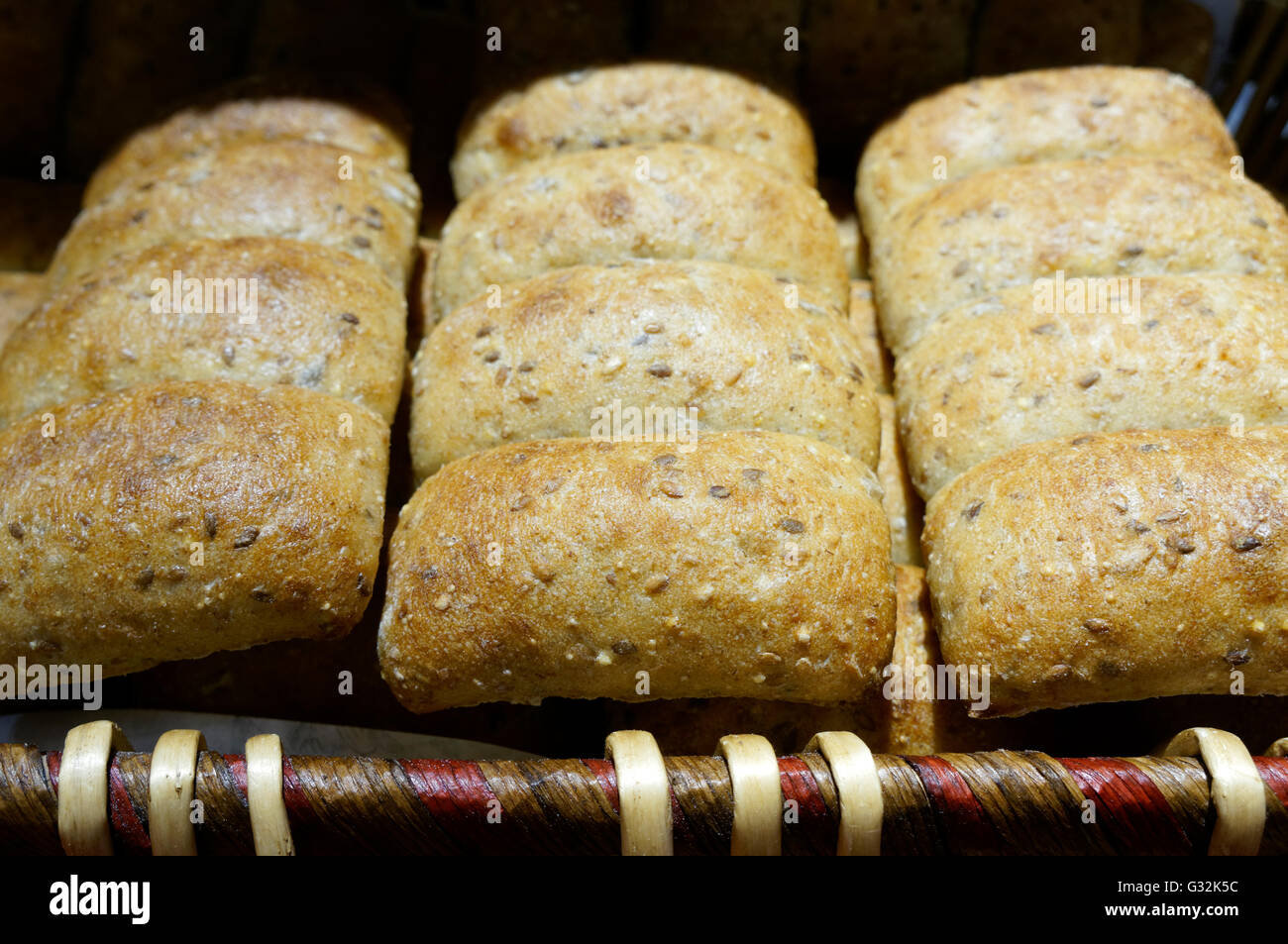 Clusters of multigrain ciabatta rolls in a bakery Stock Photo