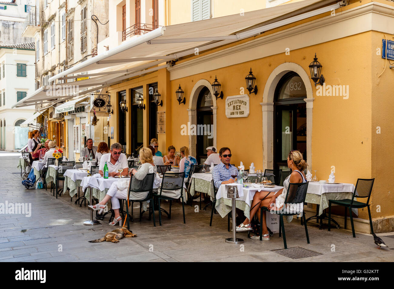 People Eating At A Restaurant In Corfu Town, Corfu Island, Greece Stock Photo