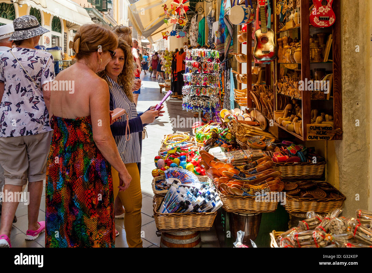 Tourists Buying Souvenirs In Corfu Old Town, Corfu, Greece Stock Photo