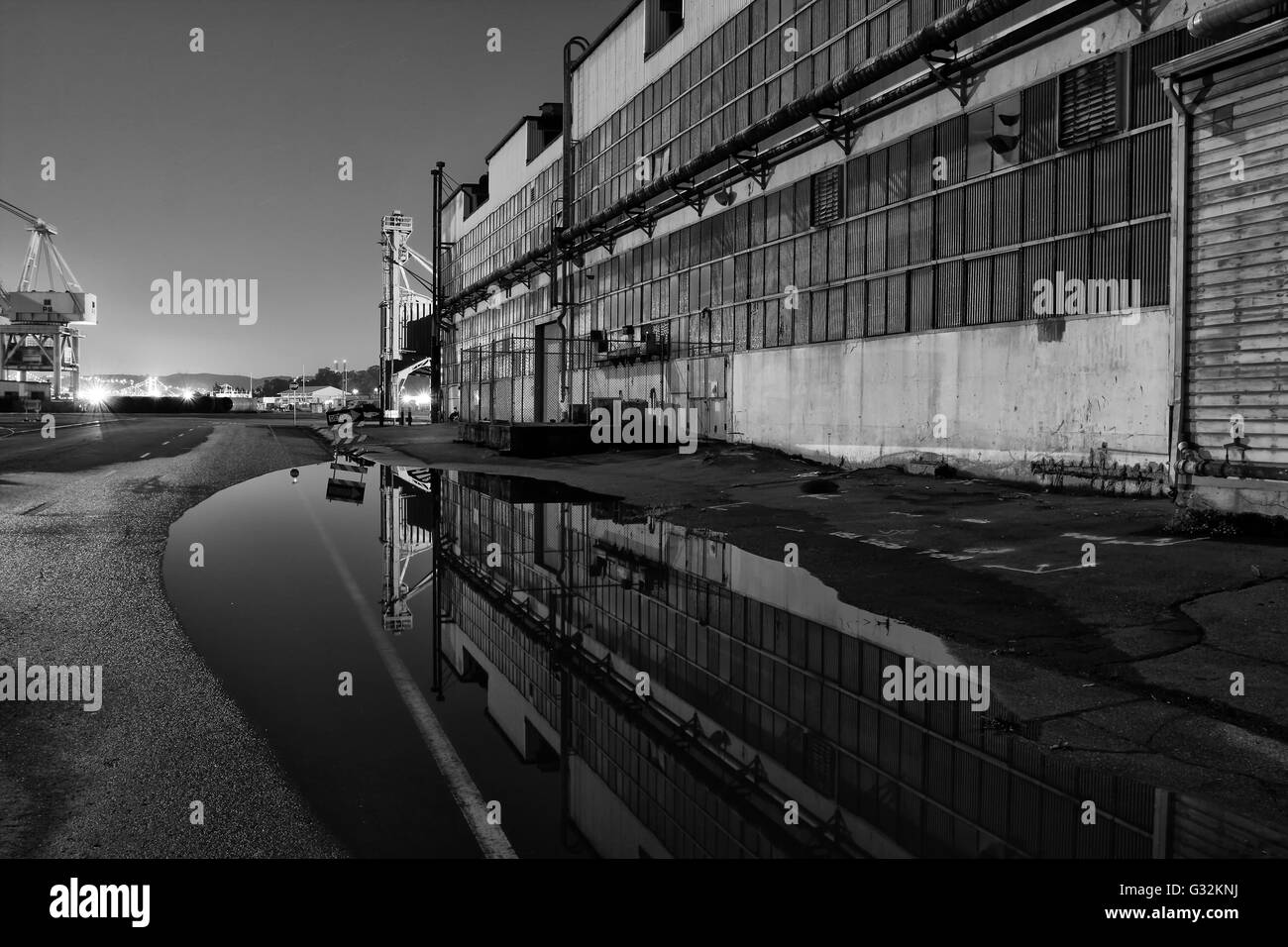 Night image taken at Mare Island, located in Vallejo, California. Puddle provided a fantastic reflection of the adjacent buildin Stock Photo
