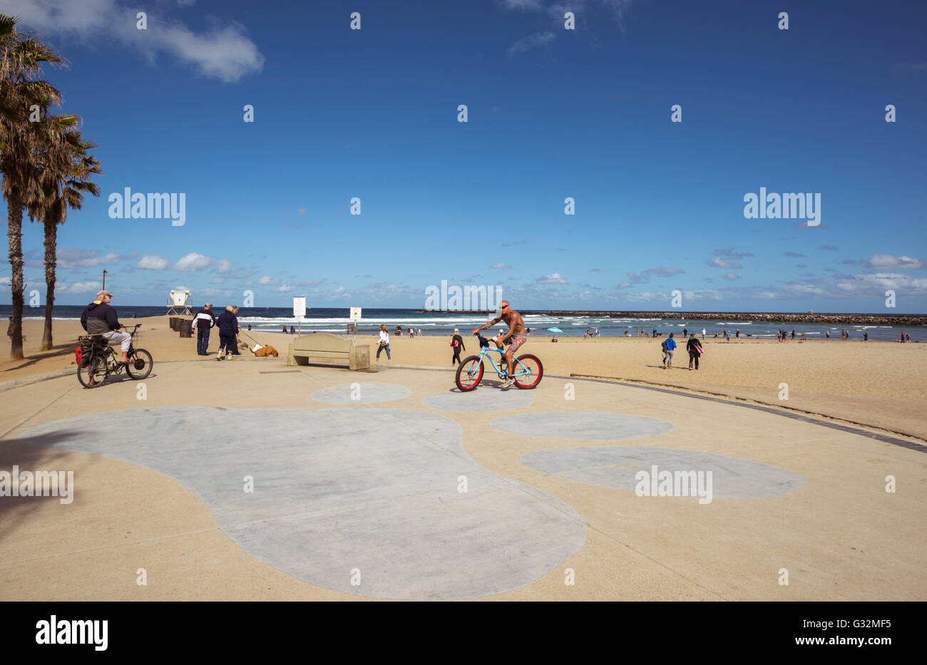 People and dogs at Dog Beach at Ocean Beach. San Diego, California. Stock Photo