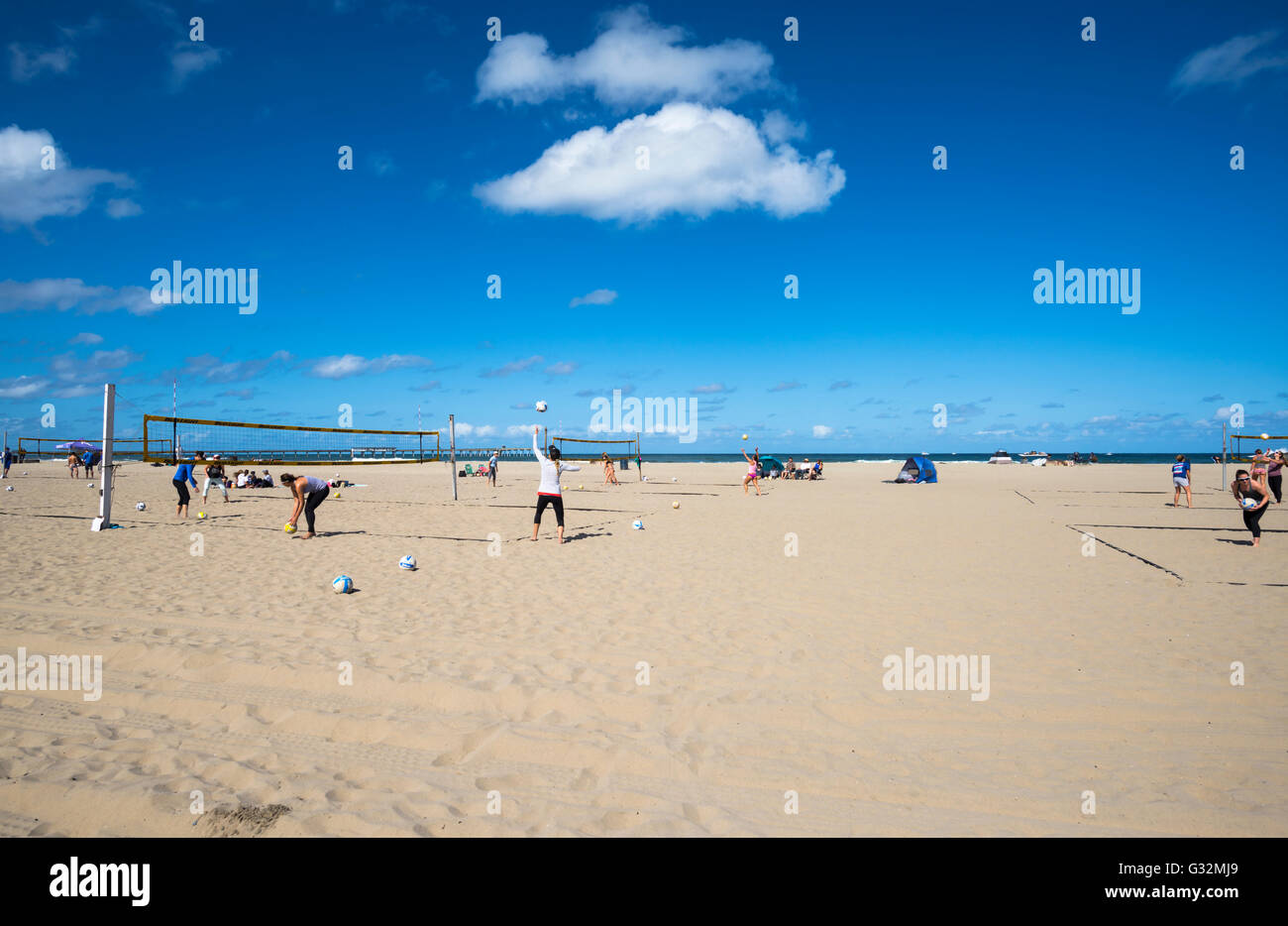 People playing beach volleyball at Ocean Beach. San Diego, California