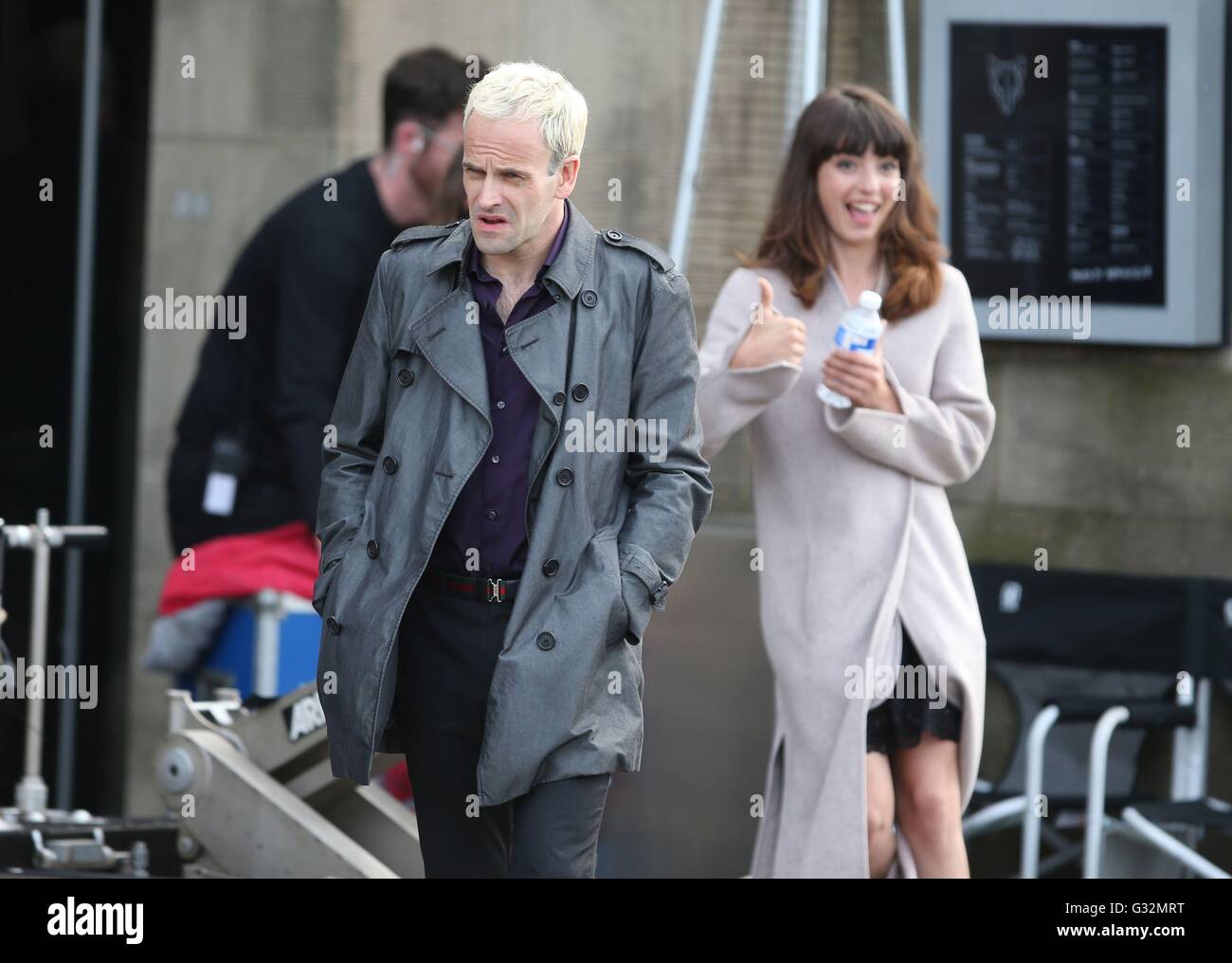 Actor Jonny Lee Miller (left) with an unknow actress during the filming of a scene from his new film Trainspotting 2 which is being filmed in Edinburgh. Stock Photo