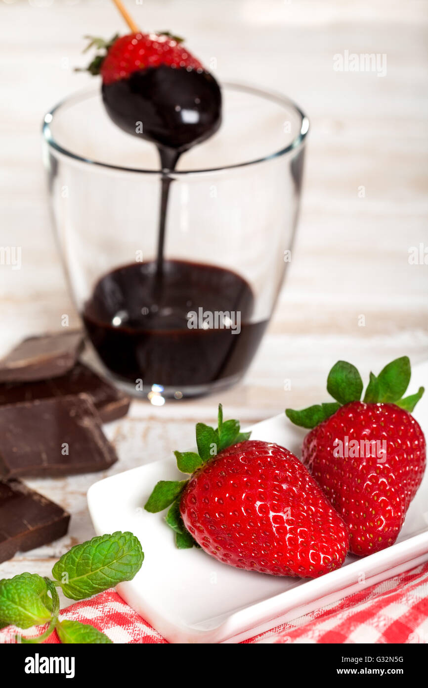 Fresh strawberry dipped in melted chocolate Stock Photo Alamy