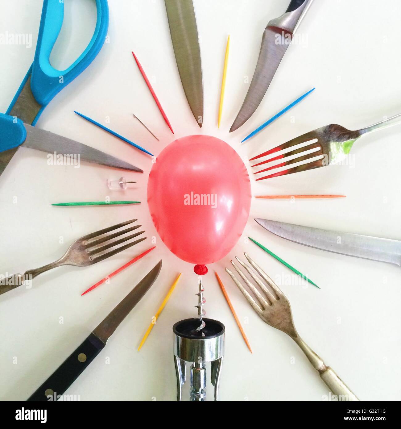 Balloon surrounded by sharp objects Stock Photo