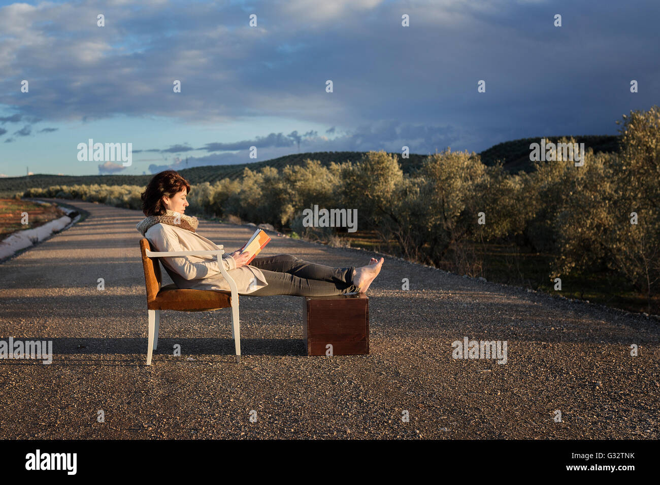 Woman sitting chair side view hi-res stock photography and images - Alamy