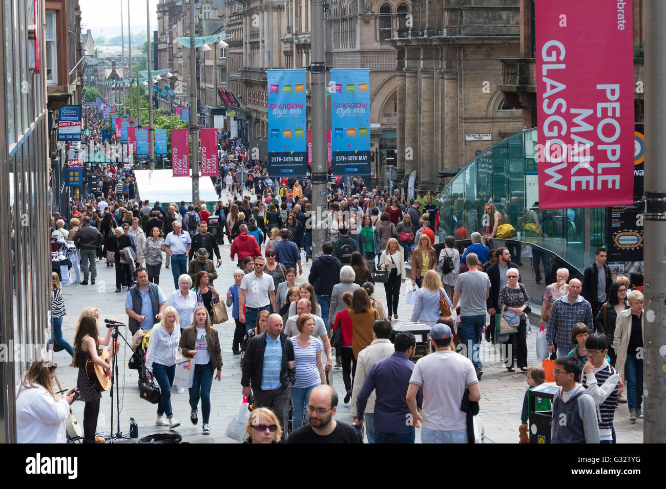 View of shoppers on busy Buchanan Street, popular shopping street,  in central Glasgow United Kingdom Stock Photo