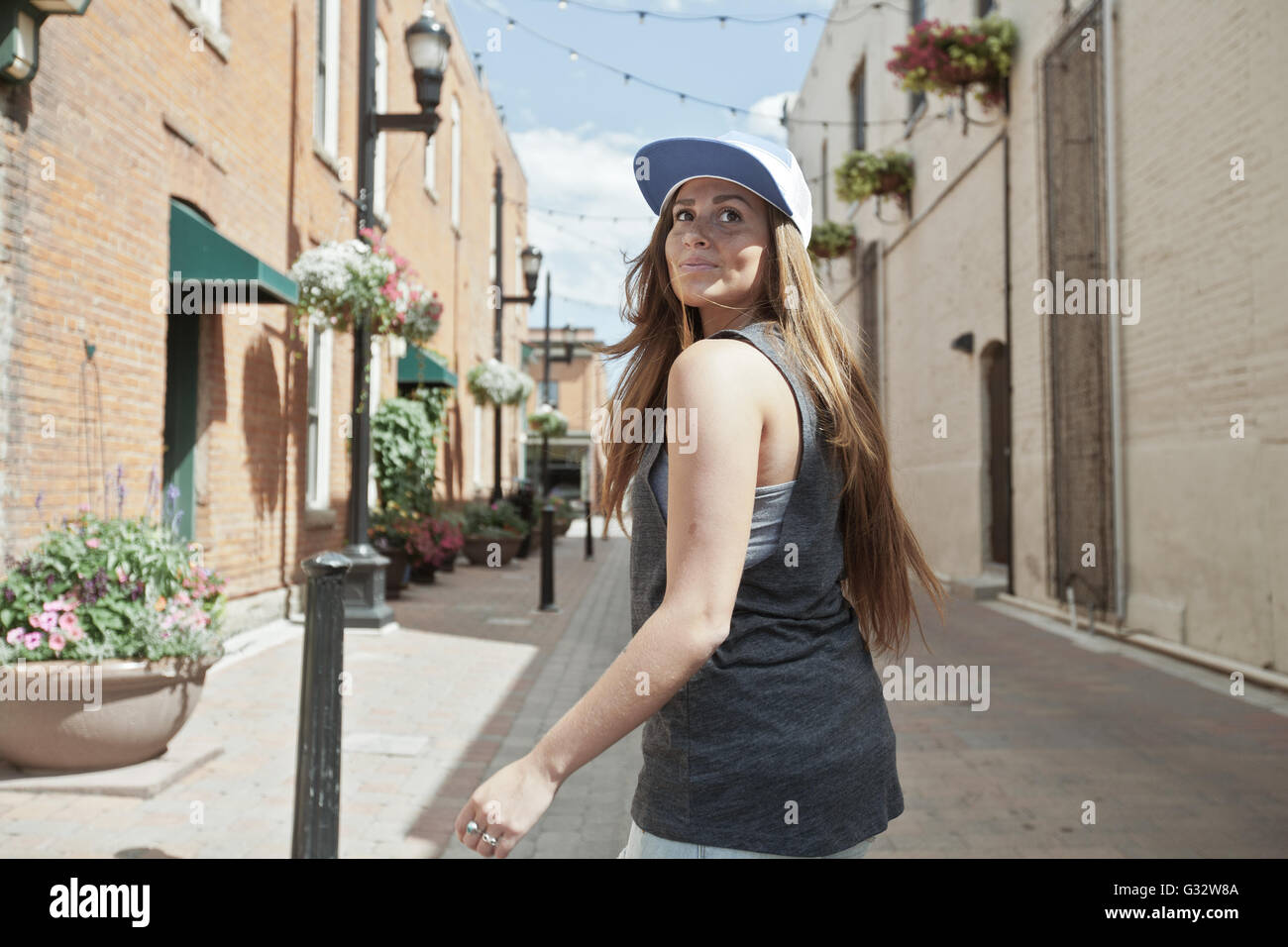 Woman walking through city, Colorado, United States Stock Photo