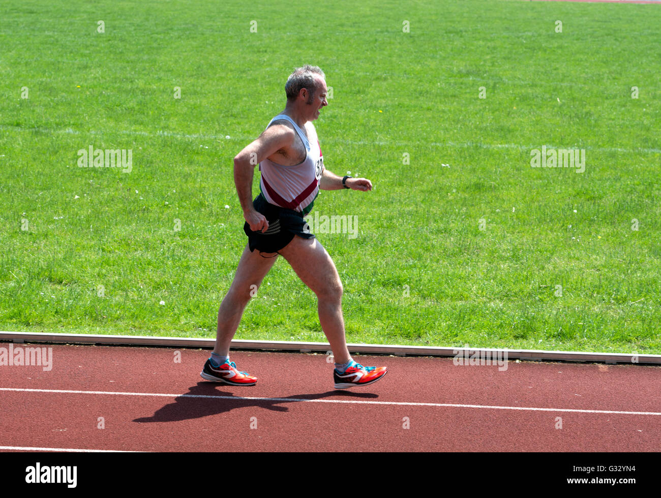 Masters athletics UK. Male athlete in a walking race Stock Photo Alamy