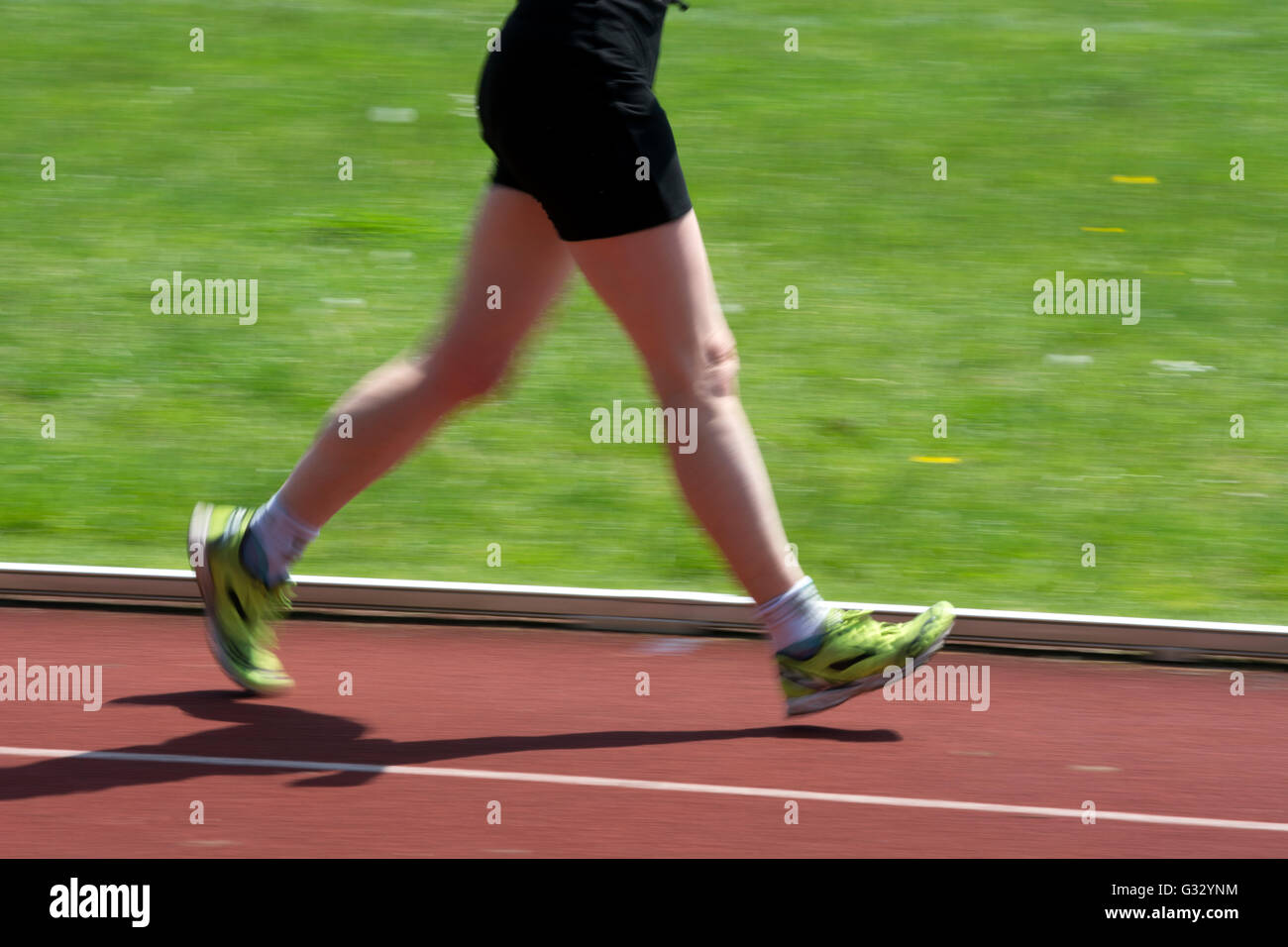 Masters athletics UK. An female athlete in a walking race showing legs