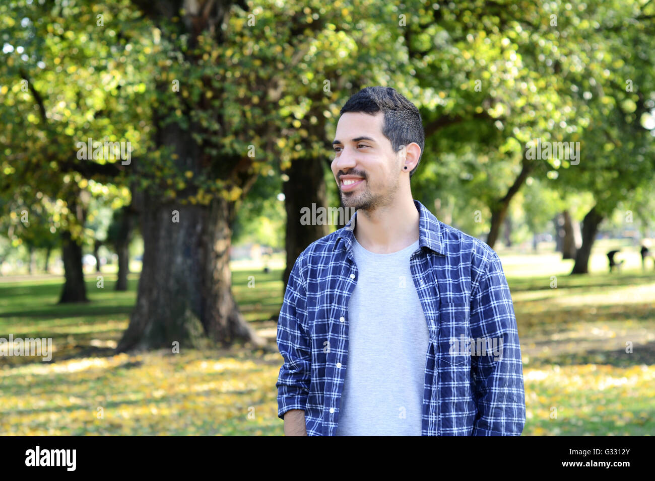 portrait-of-young-handsome-man-in-a-park-outdoors-stock-photo-alamy