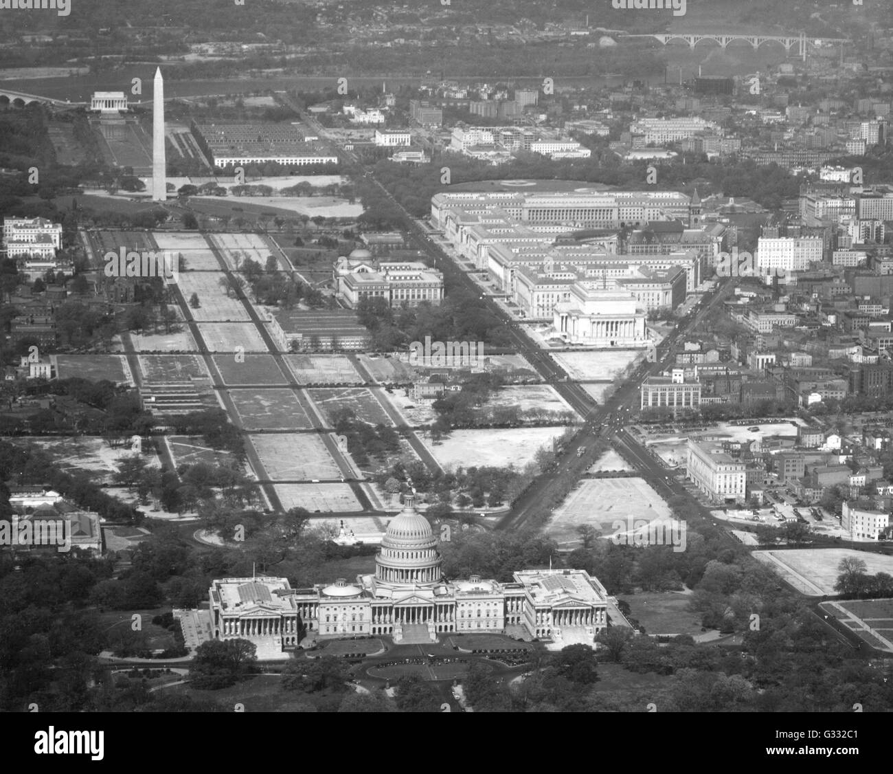 Aerial view of the Federal Triangle (upper right) with the United States Capitol in foreground, Washington, DC, circa 1940. The Washington Monument is in the upper left. Stock Photo