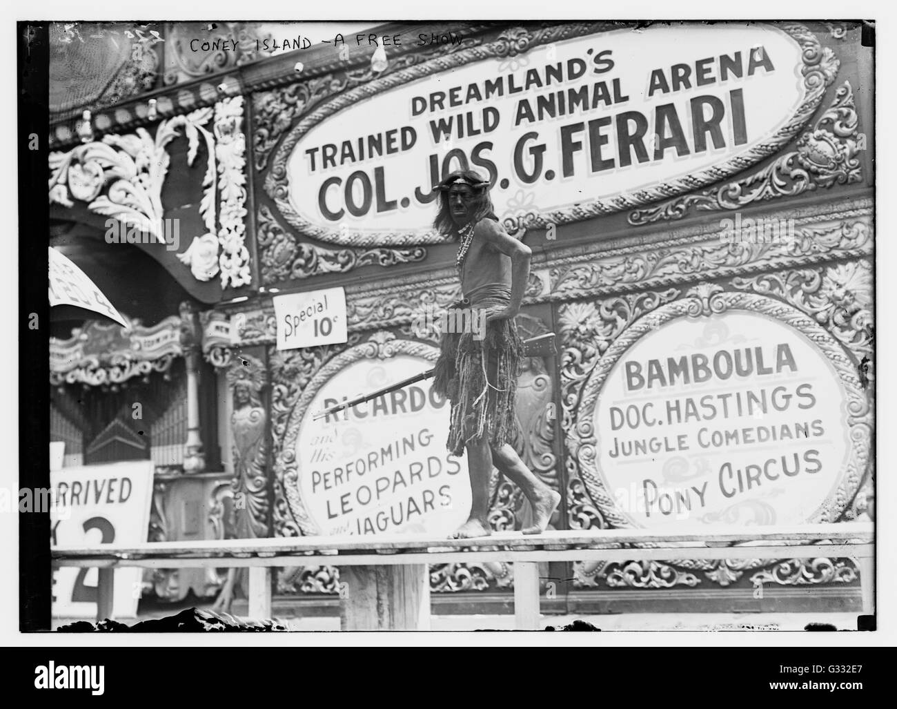 An unnamed sideshow performer brings in the crowd to Coney Island's Dreamland Trained Wild Animal Arena for a show. Stock Photo