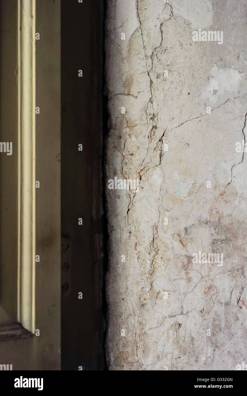 Cracked plaster and paint in a 200yearold house window recess Stock