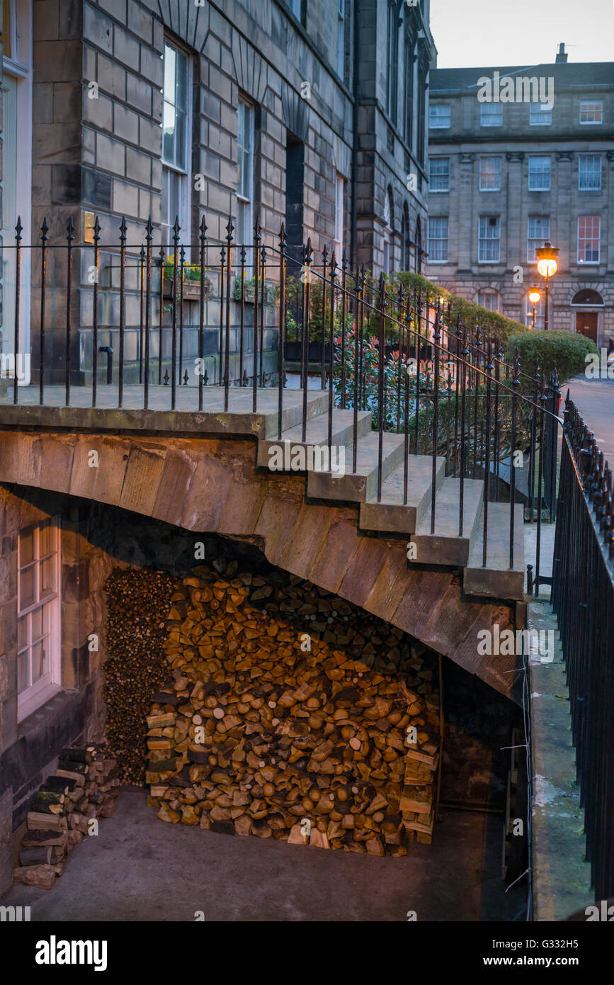 Edinburgh New Town log burning stove wood supplies outside a basement