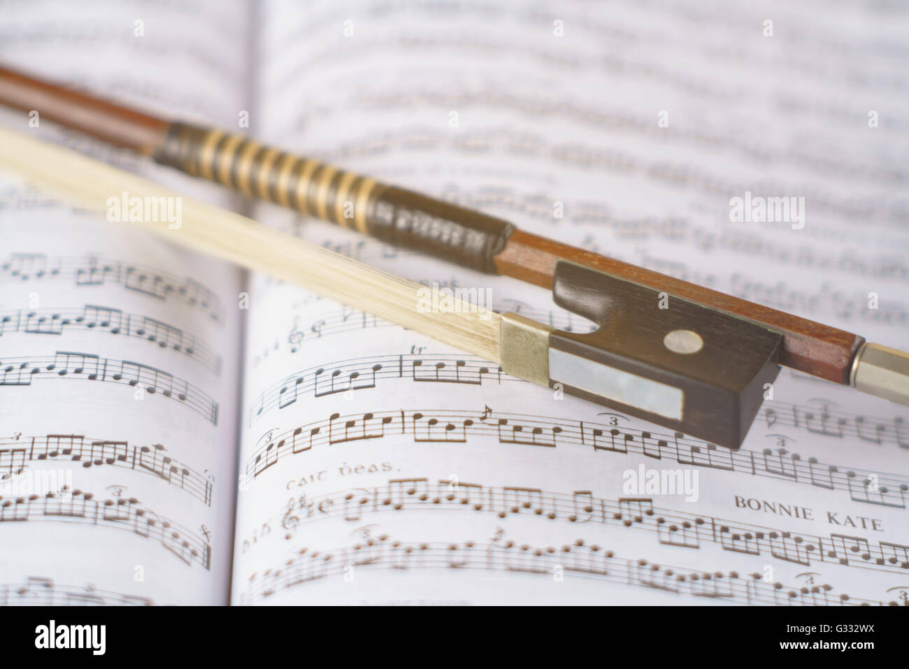 Fiddle bow with music Stock Photo
