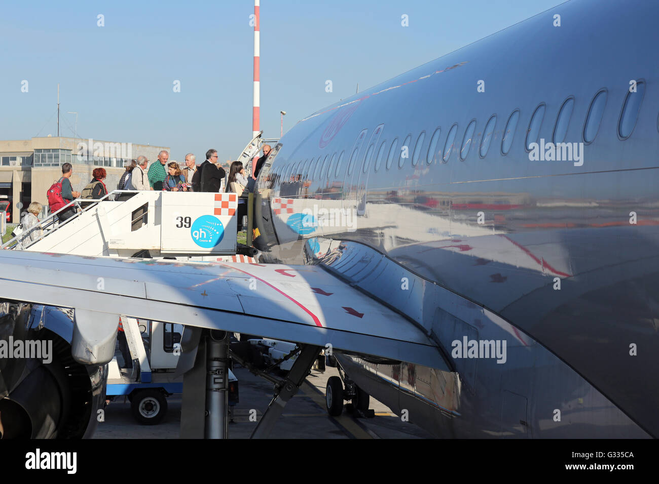 Catania, Italy, travelers go into a machine of the airline Niki Stock Photo