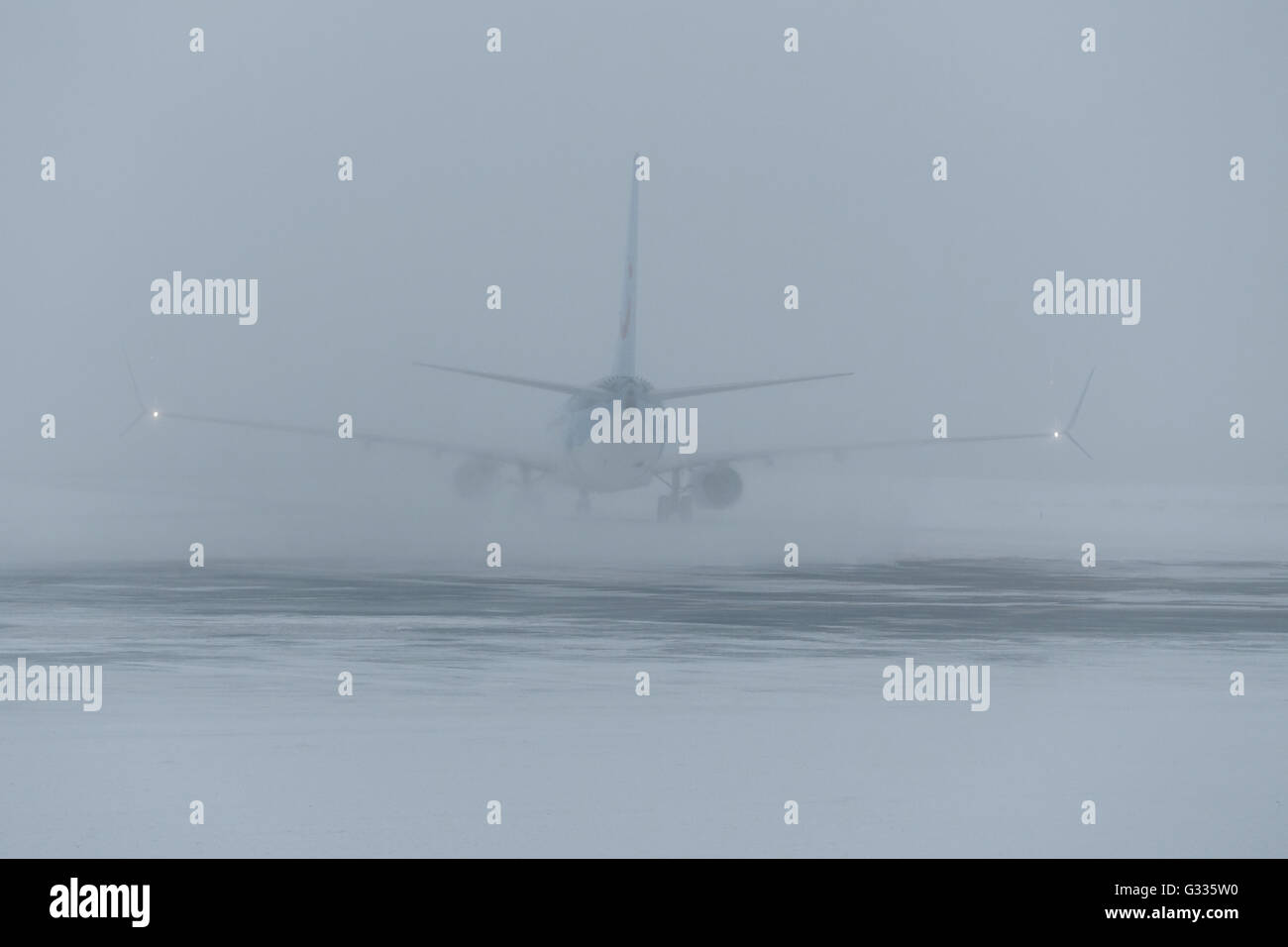 Kittilae, Finland, aircraft swirls on startup snow from the runway Stock Photo