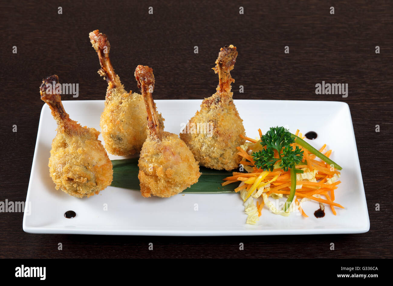 Kara-age. Fried chicken legs breaded and vegetarian side dish with ...