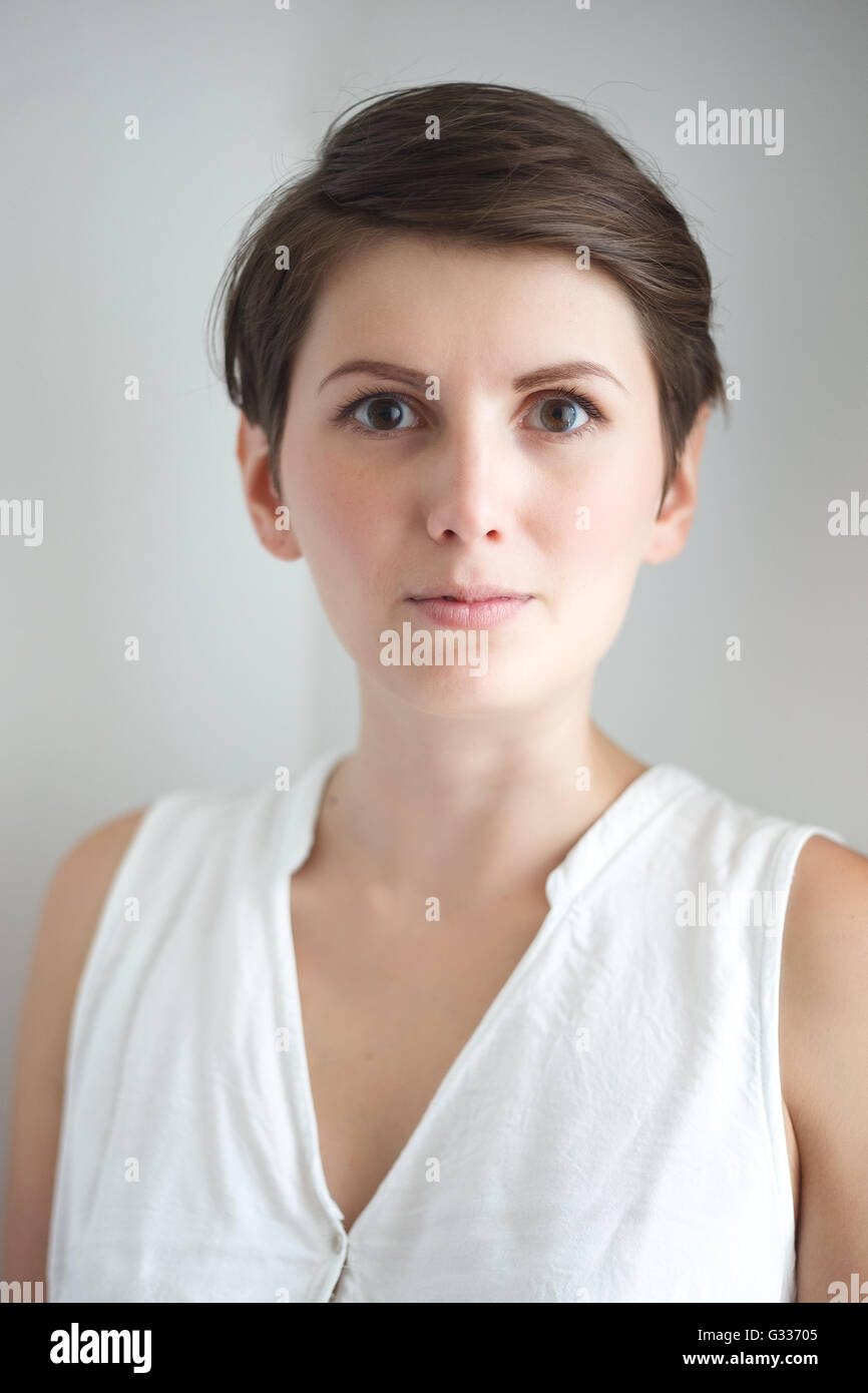 Charming Short Hair Young Woman Without Makeup On White Background