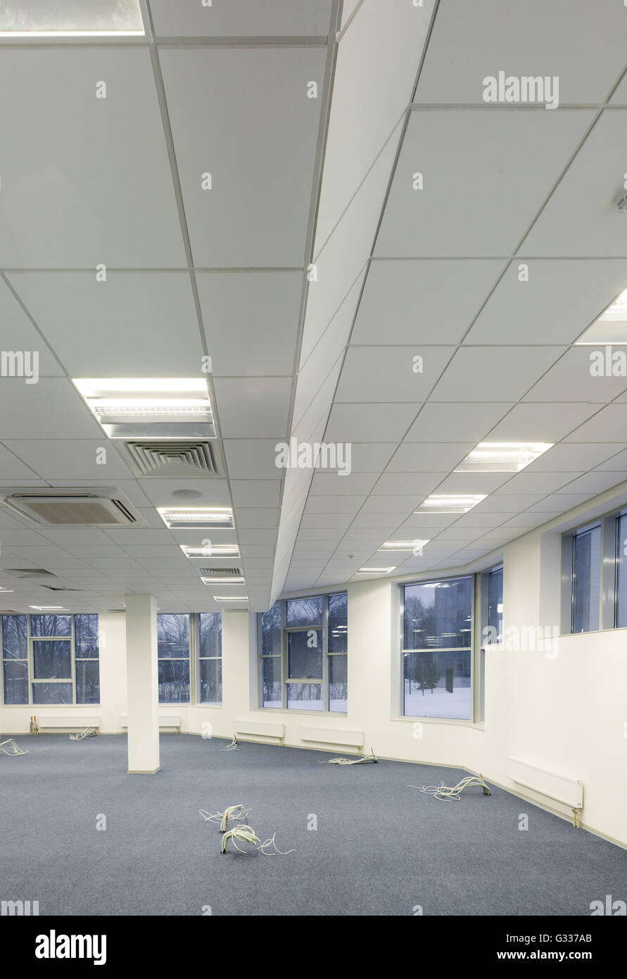 Office, repair and finishing facilities. Ceiling lighting and ventilation. Utilities. Stock Photo