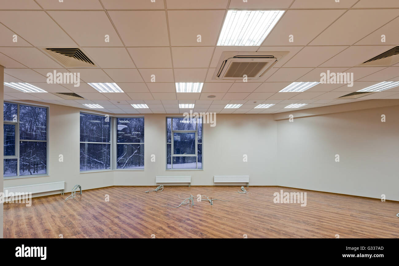 Office, repair and finishing facilities. Ceiling lighting and ventilation. Utilities. Stock Photo