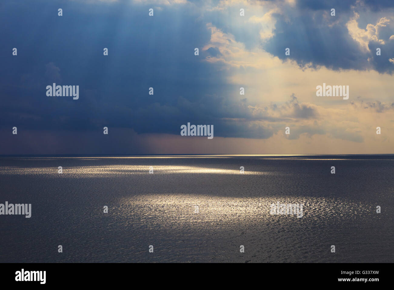 Sun rays through storm clouds hi-res stock photography and images - Alamy