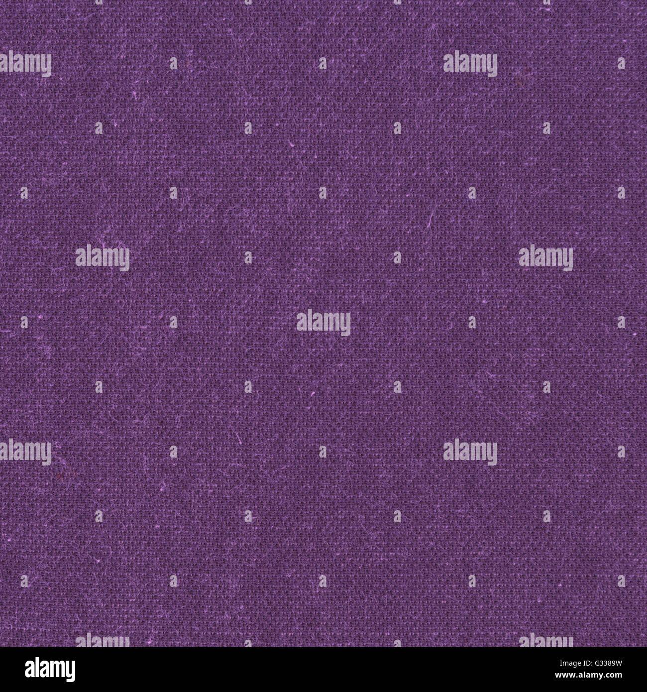 Purple wool knitted fabric texture. Close up fragment of the top view. Stock Photo