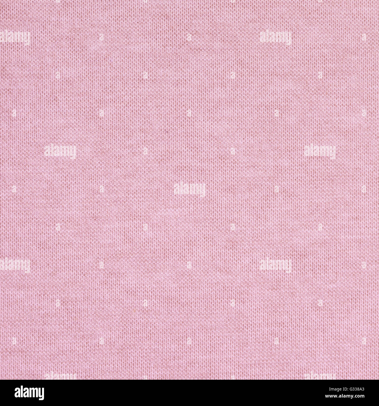 Pale pink knitted fabric texture. Close up fragment of the top view. Stock Photo