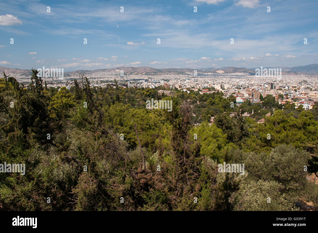 Panoramic view of the city of Athens with green trees from Acropolis Hill in Greece. Stock Photo