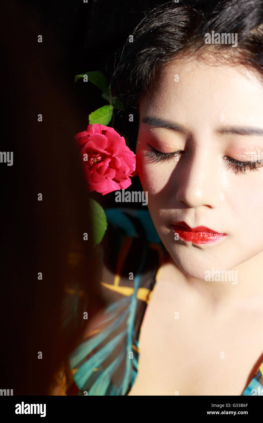 Asian girls are making up face feature Stock Photo - Alamy
