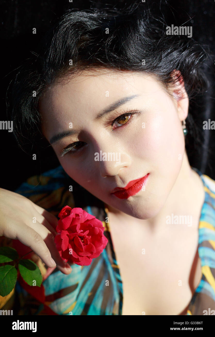 Asian girls are making up face feature Stock Photo