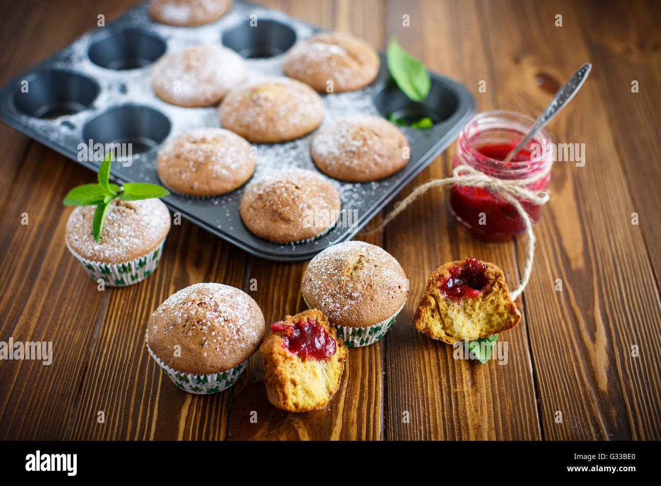 sweet baked muffins with jam inside Stock Photo Alamy