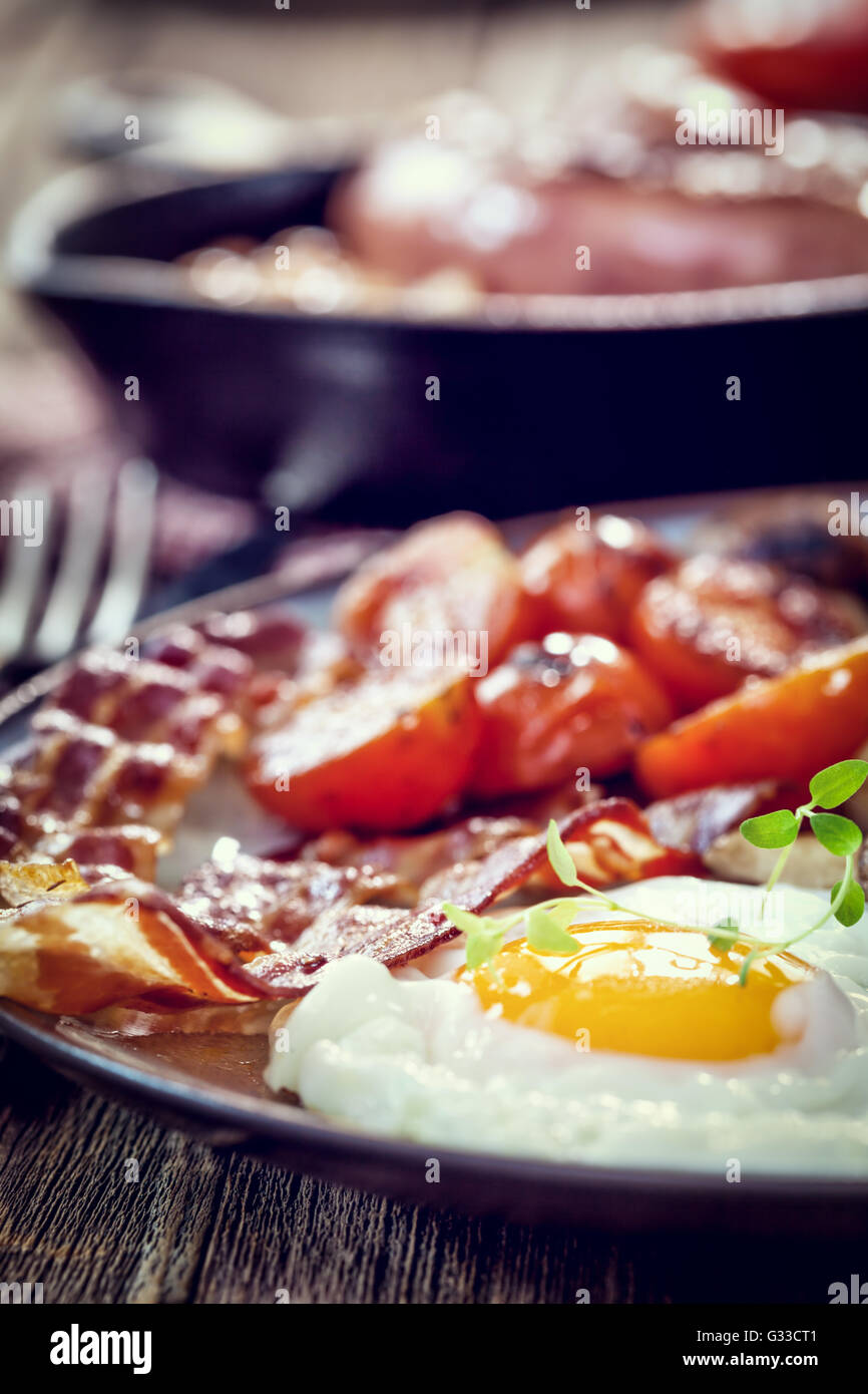 English breakfast with eggs, tomatoes, mushrooms, bacon, beans Stock