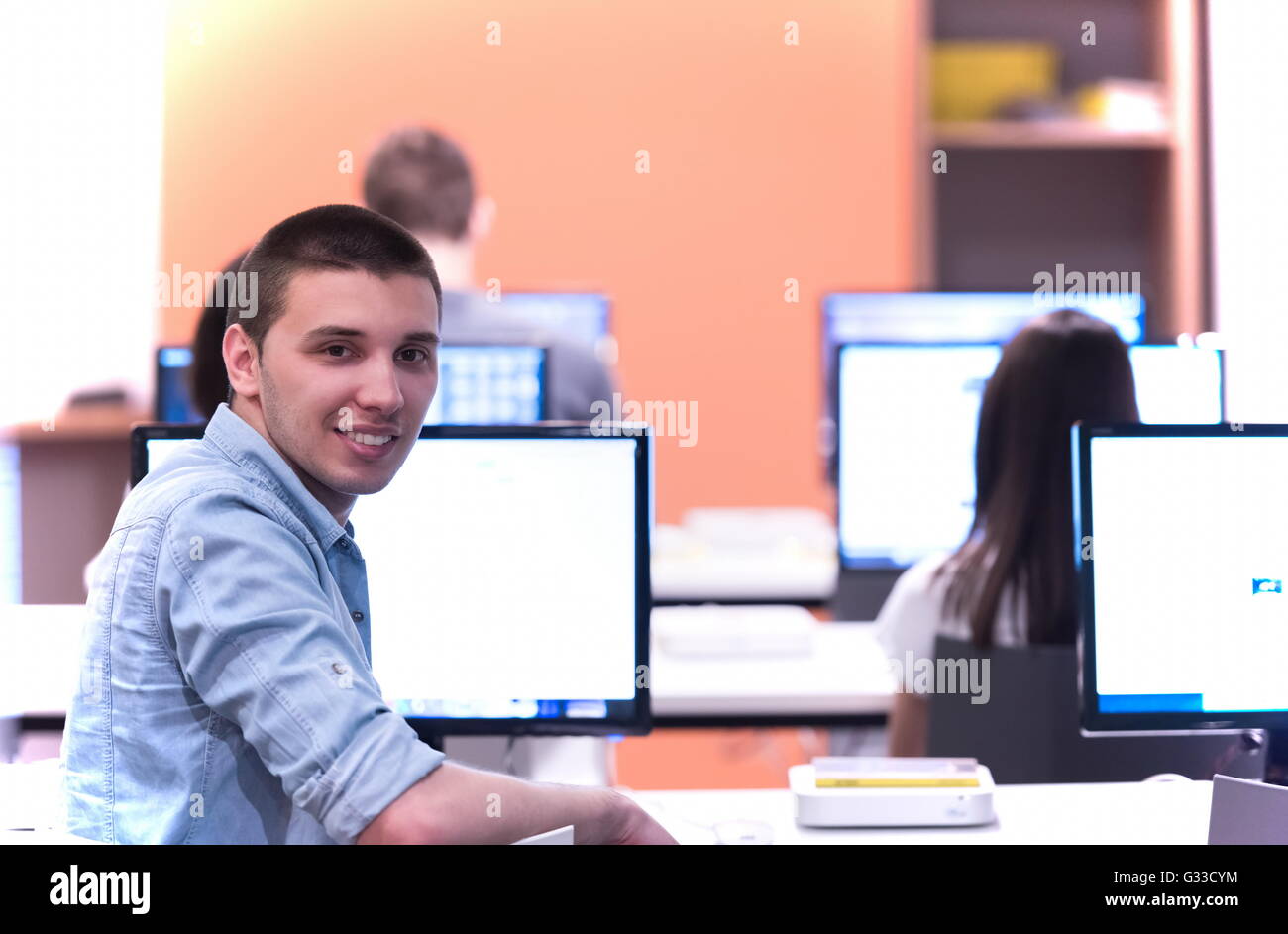 technology students group in computer lab school classroom working on ...