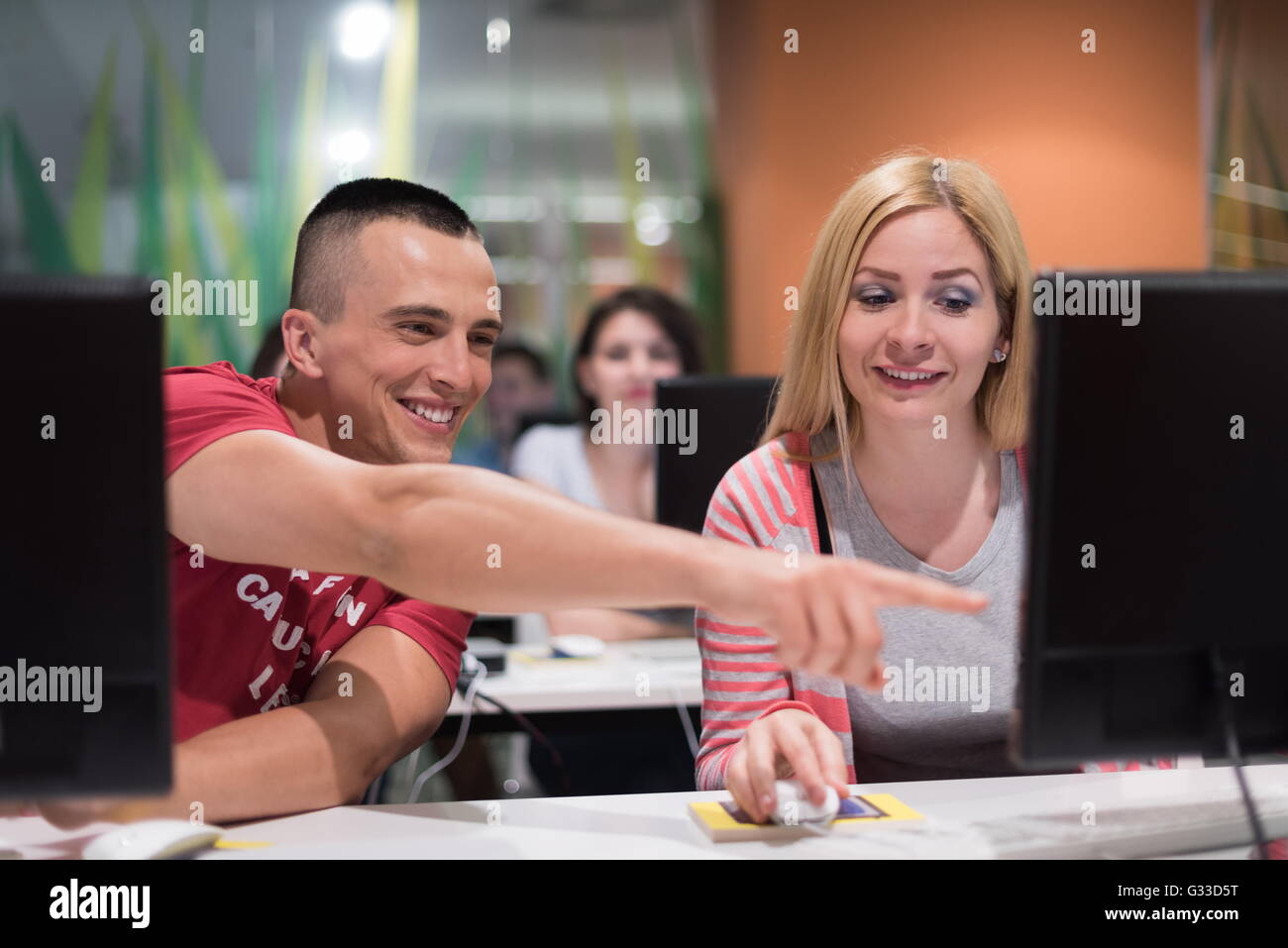 technology students group in computer lab school classroom working on ...