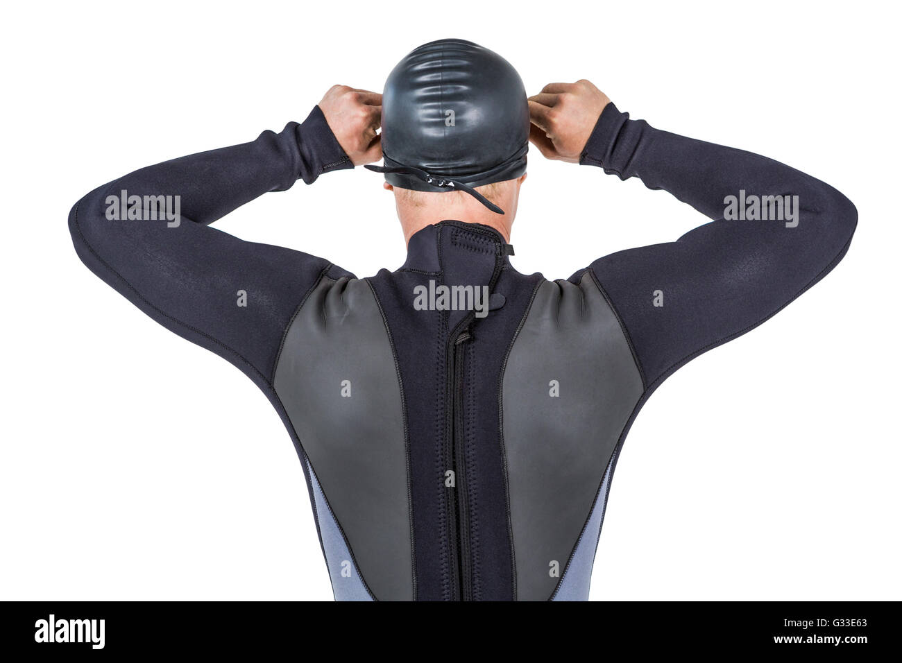 Rear view of swimmer in wetsuit wearing swimming goggles Stock Photo