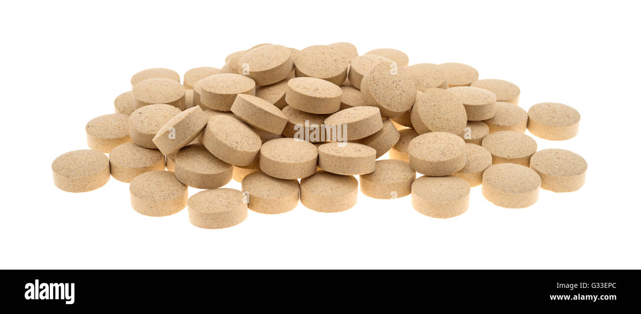 A group of brewer's yeast nutritional supplement tablets isolated on a white background. Stock Photo