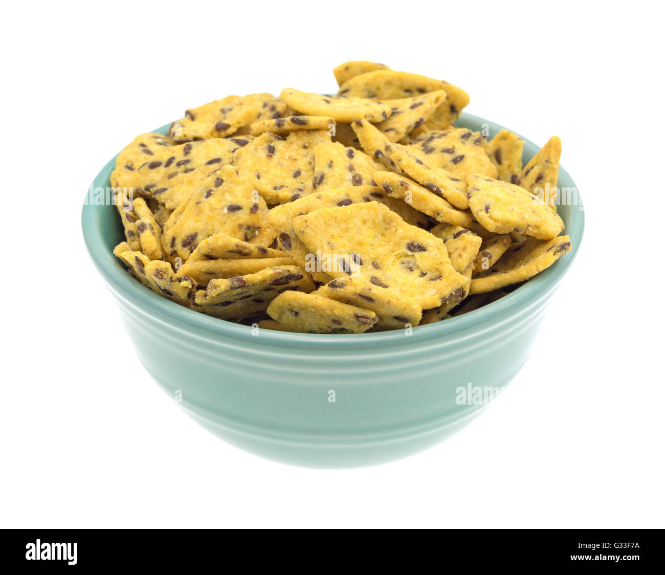Side view of a filled bowl of flax seed corn chips isolated on a white