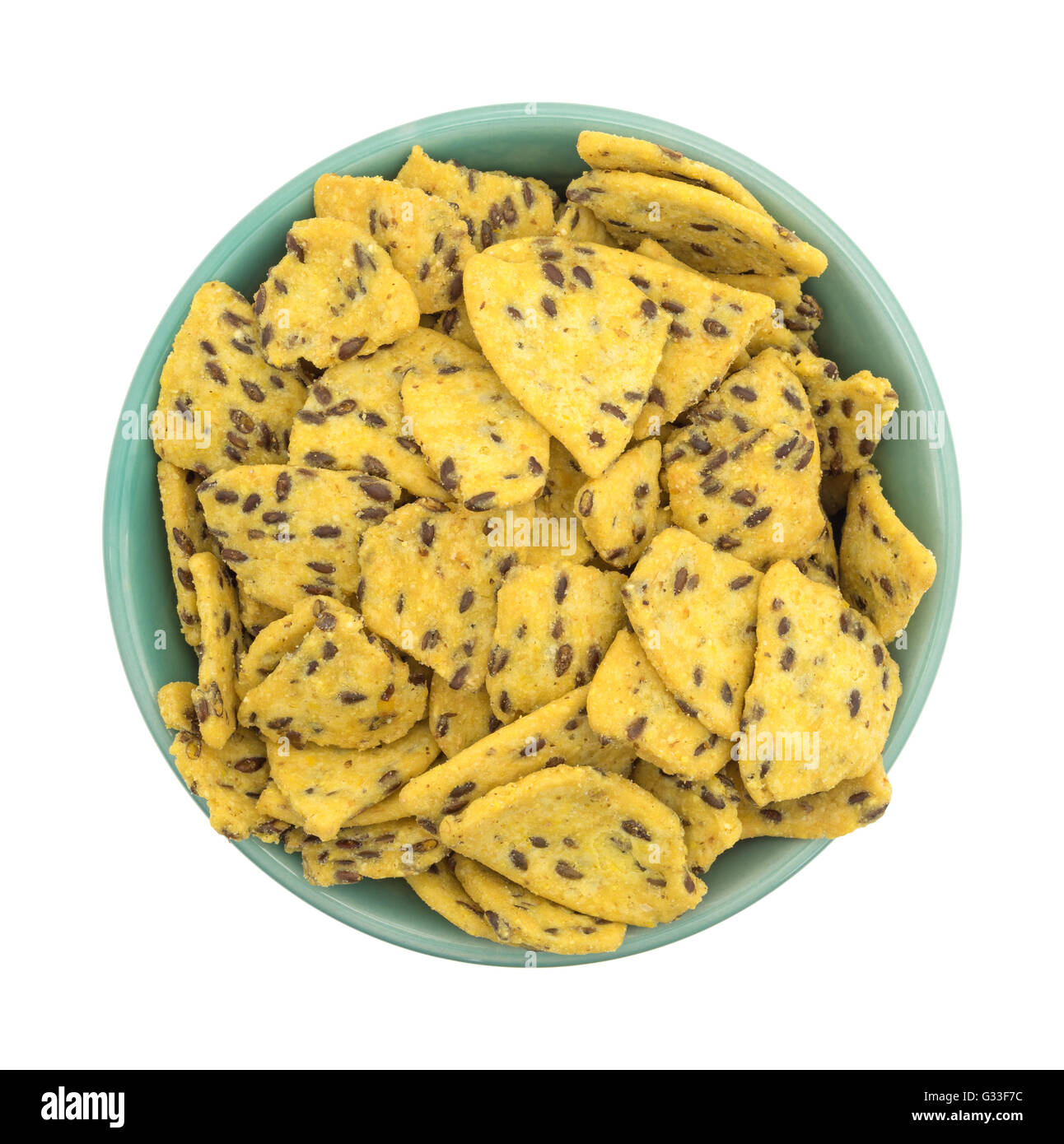 Top view of a filled bowl of flax seed corn chips isolated on a white