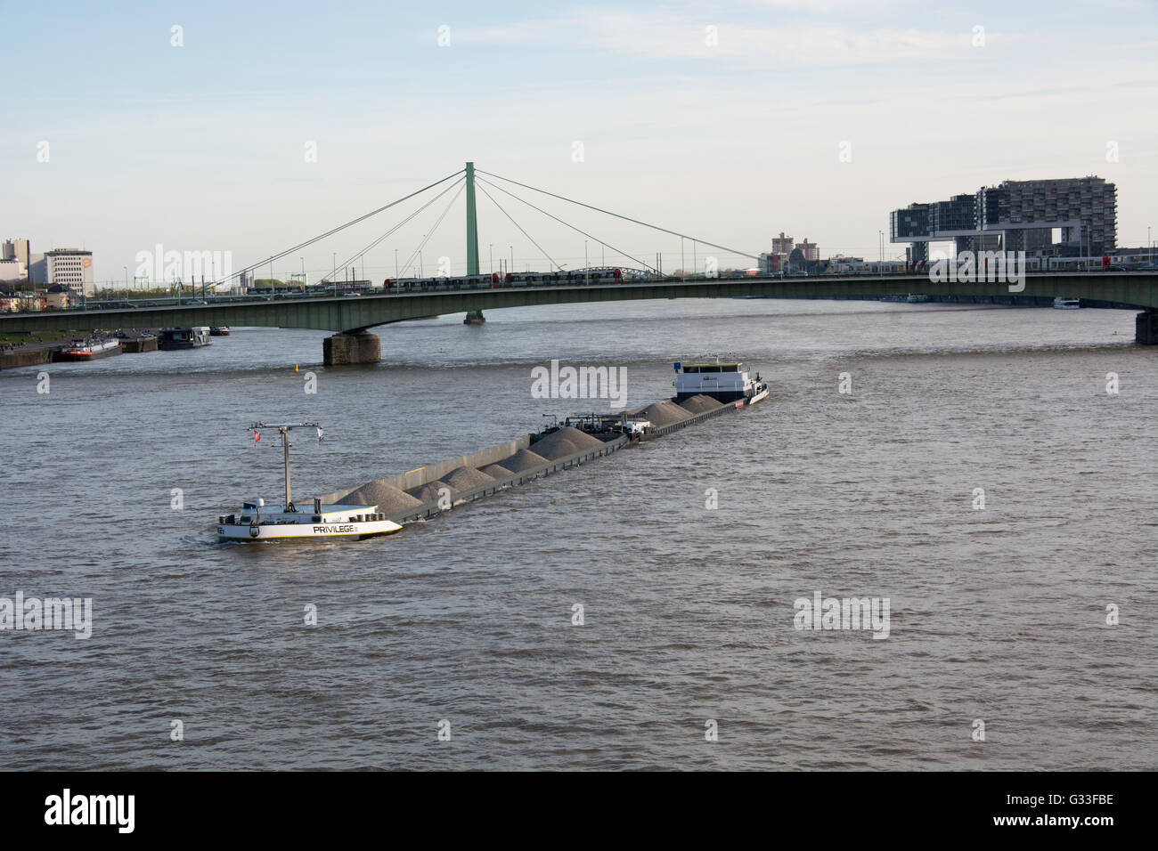 The motor barge Privilage II passes through Köln (Cologne) as it travels along the River Rhine Stock Photo
