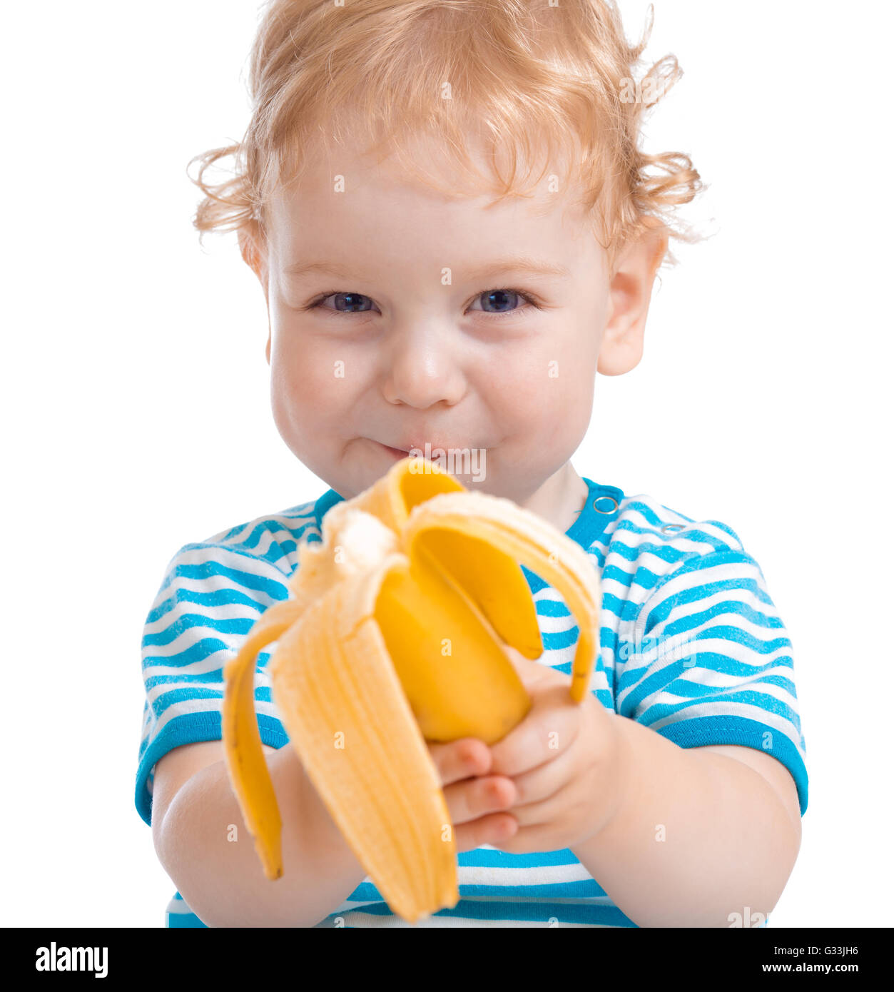 Happy kid or child eating banana Stock Photo Alamy