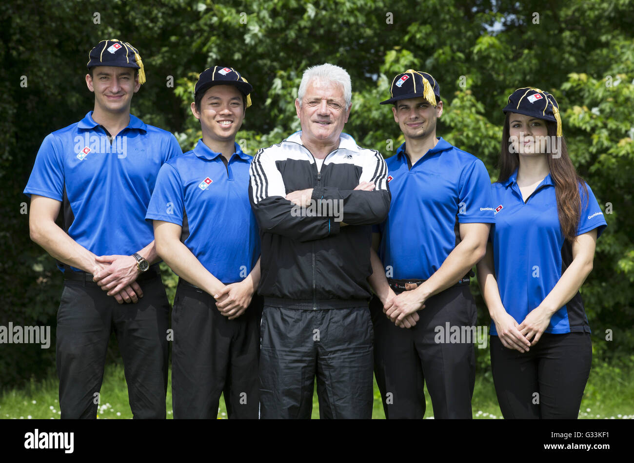 EDITORIAL USE ONLY Former England football player and manager Kevin Keegan ' caps' new employees (left to right) Tibor Mester, Ricafort Gamboa, Viktor  Bondar and Eva Juhasz, as they join the Domino's team,