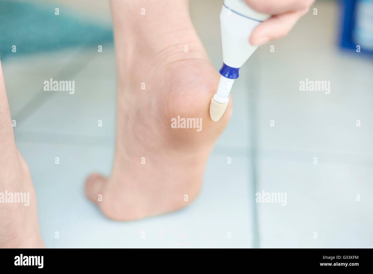 Electric foot scrubber being used in pedicure Stock Photo Alamy