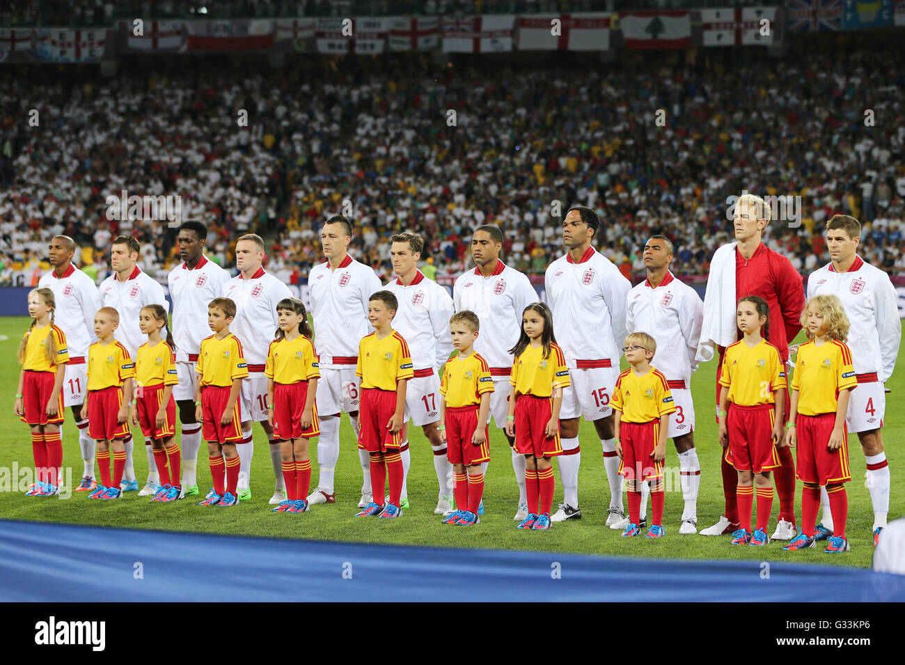 KYIV, UKRAINE - JUNE 24, 2012: Players of England football team sing the national anthen before UEFA EURO 2012 Quarter-final game against Italy at Olympic stadium in Kyiv, Ukraine Stock Photo