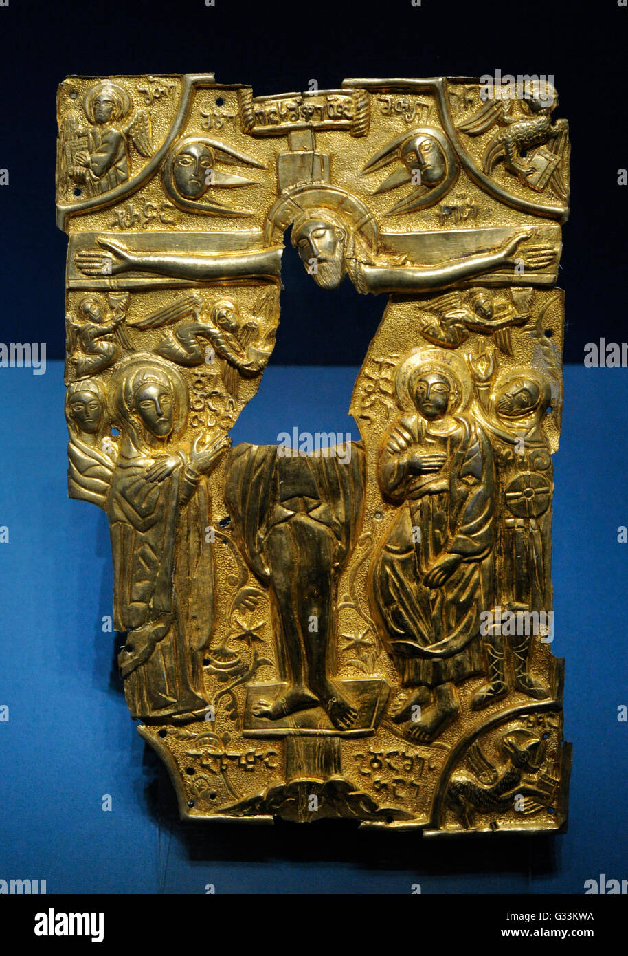 Trimming of Gospel cover. Silver, gilding, embossing. 17th c. Crucifixion. Georgia. The State Hermitage Museum. Saint Petersburg. Russia. Stock Photo
