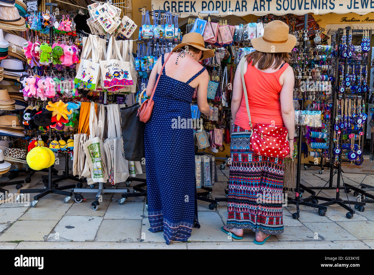 Two Young Women Shopping For Souvenirs, Corfu Old Town, Corfu, Greece Stock Photo