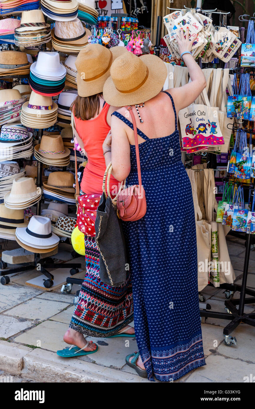 Two Young Women Shopping For Souvenirs, Corfu Old Town, Corfu, Greece Stock Photo