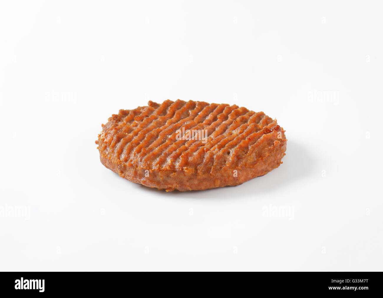 roasted hamburger patty on white background Stock Photo
