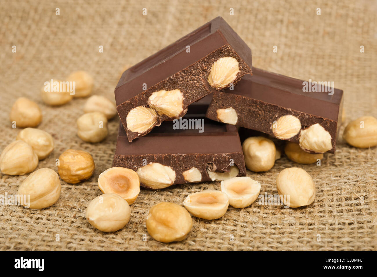 Bar of chocolate with hazelnuts Stock Photo
